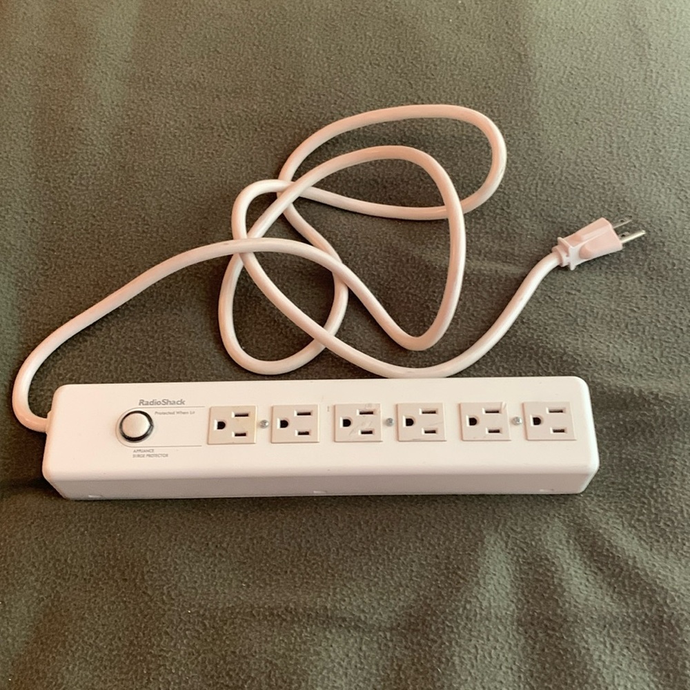 Radio Shack surge protector power strip. Approximately 13 inches